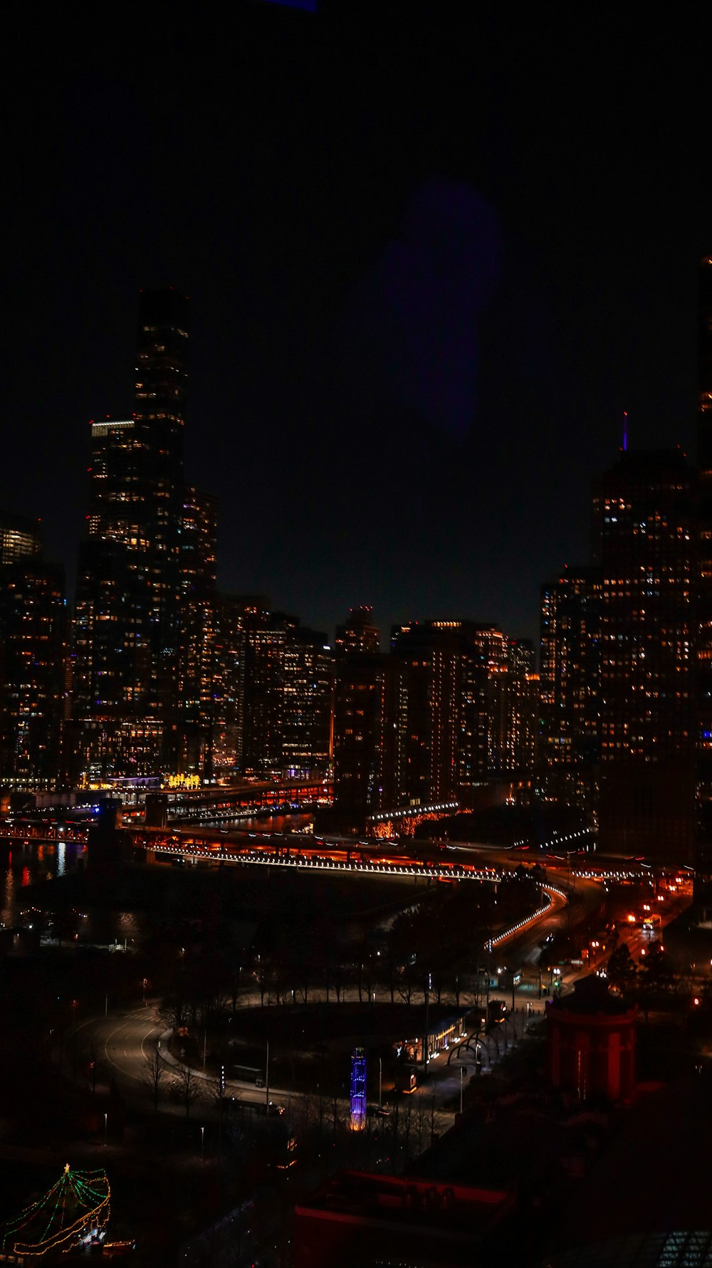 a night view of a city with lots of tall buildings