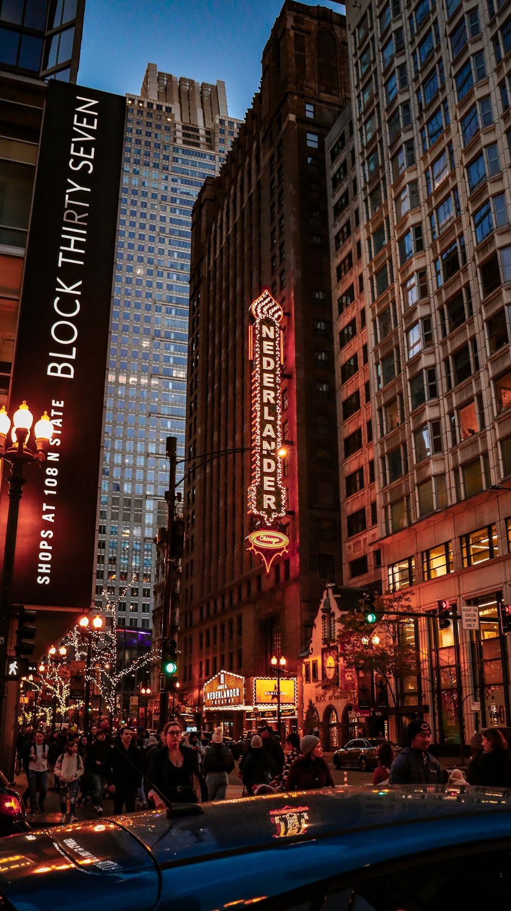 a city street filled with traffic and tall buildings