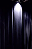 Soft animation effect highlighting a dramatic curtain opening on stage.