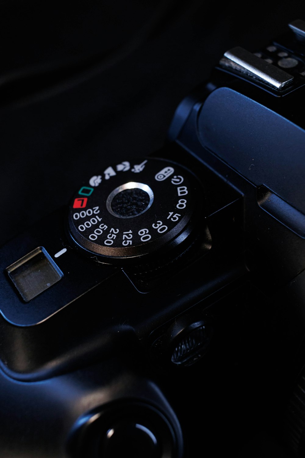 a close up of a camera on a black background