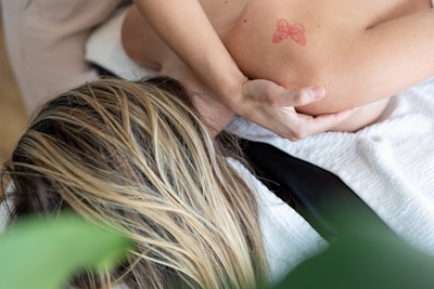 a woman getting a back massage in a spa