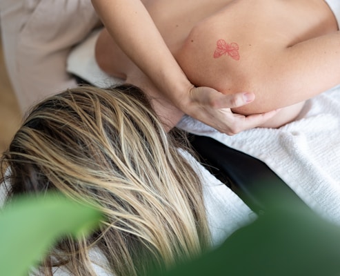 a woman getting a back massage in a spa