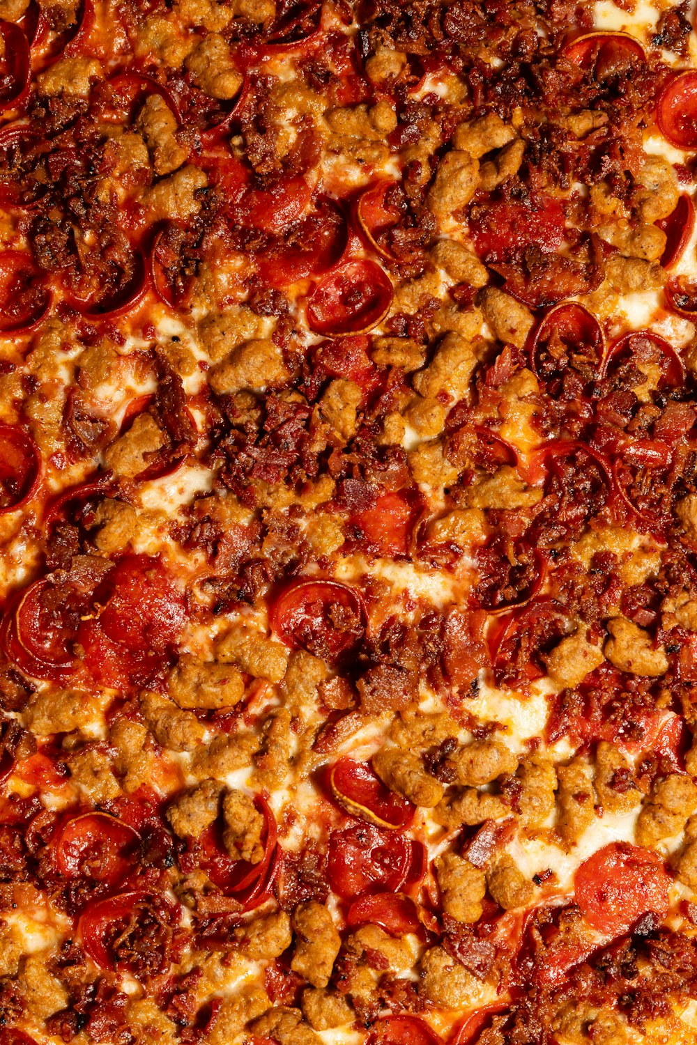a close up of a pizza with toppings on it