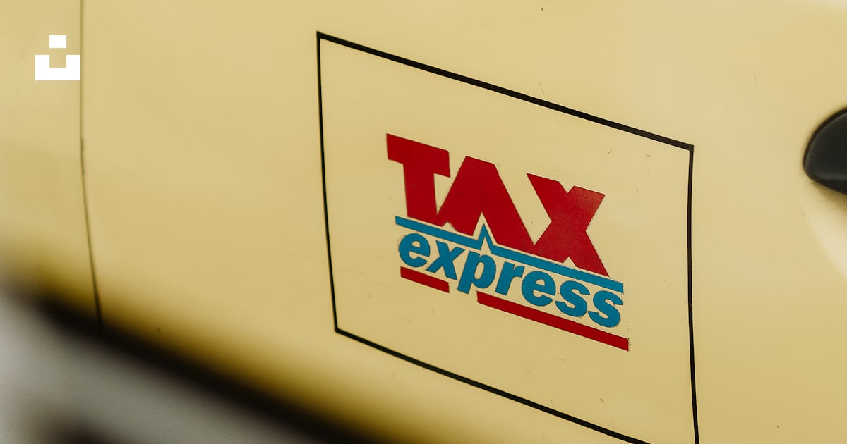 A close up of a tax express sticker on a car photo – Free Portrait ...