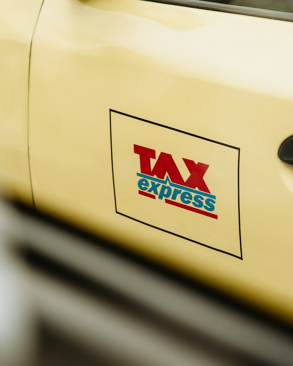 a close up of a tax express sticker on a car