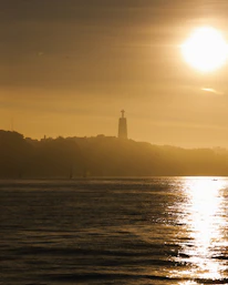 A scenic sunset over a famous travel destination, bathed in golden light.