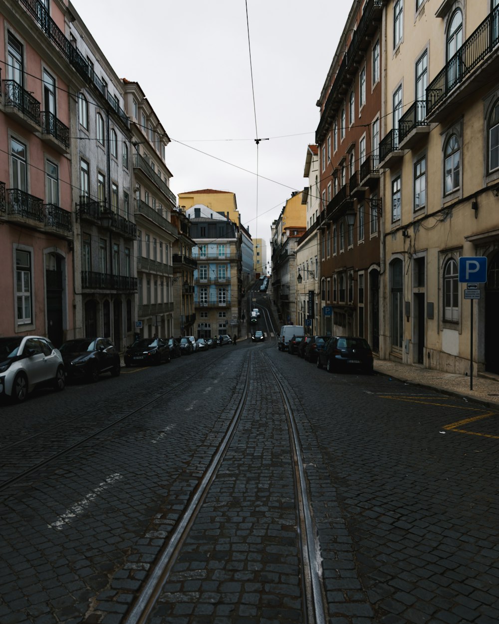 a city street with cars parked on both sides of it