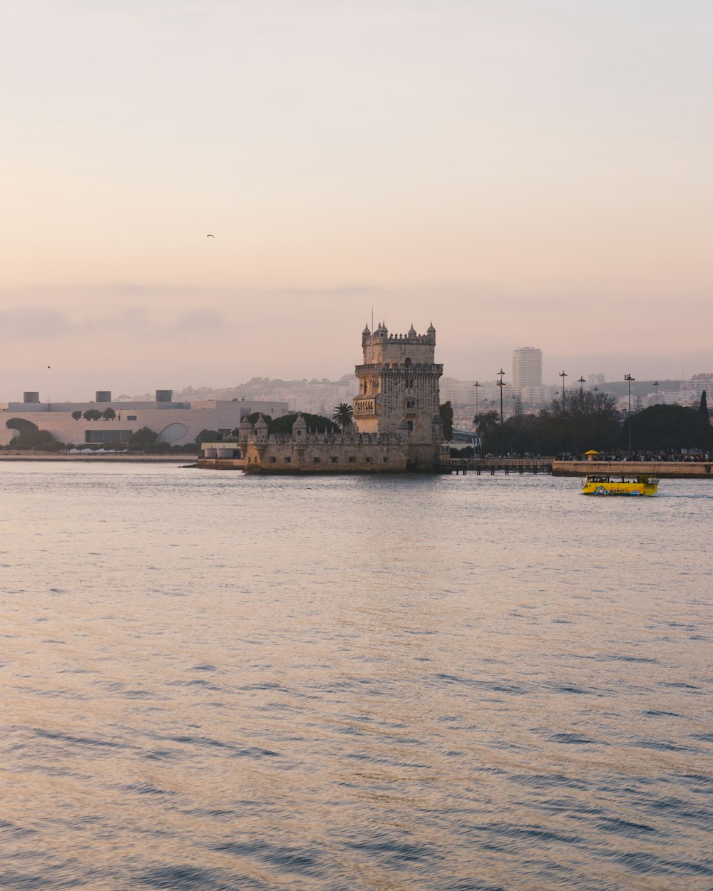 a large body of water with a tower in the middle of it