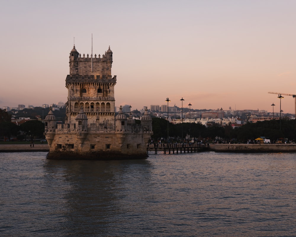 a tall tower sitting on top of a body of water