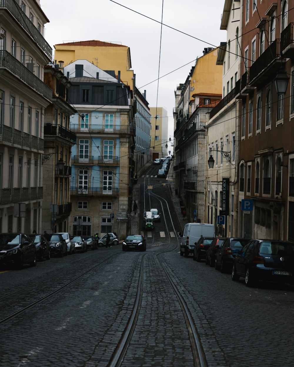 a street with cars parked on both sides of it