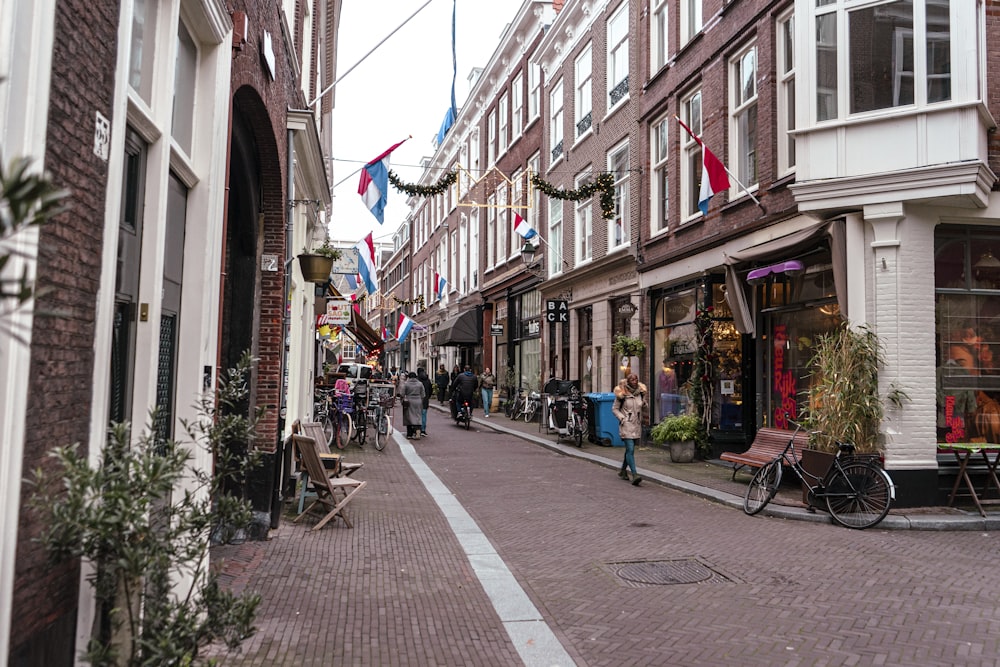 a city street lined with tall brick buildings