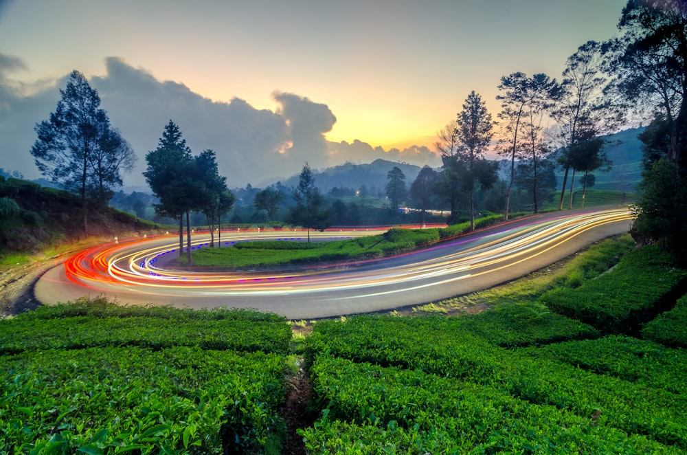 a long exposure shot of a road at dusk