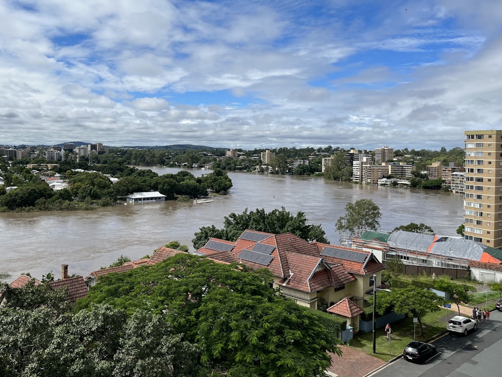 a river running through a city next to tall buildings