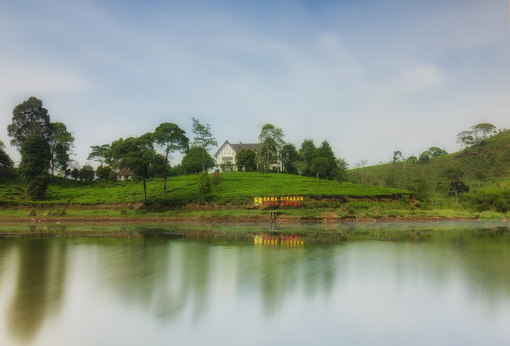 a house on a hill overlooking a lake