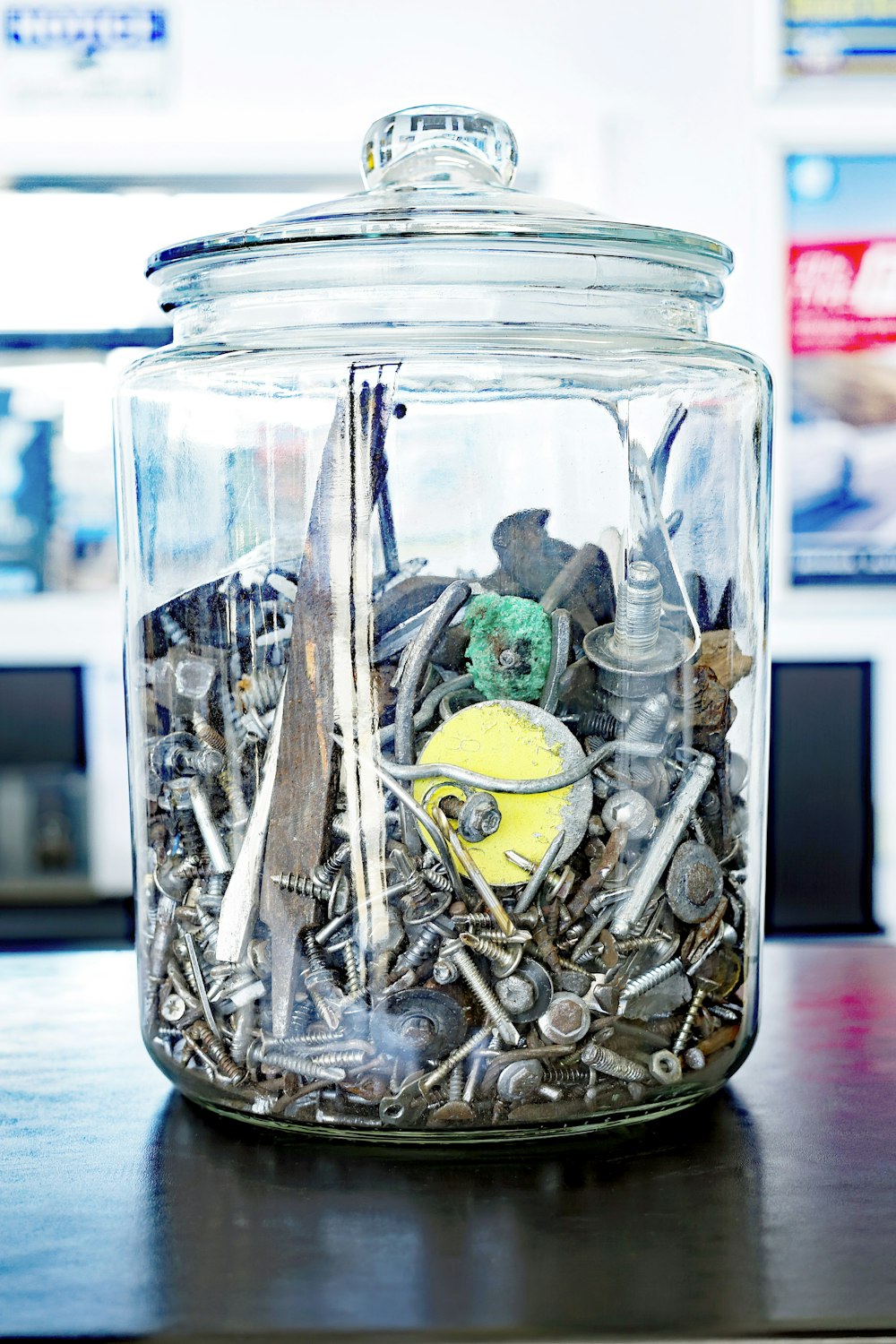 a glass jar filled with lots of different items
