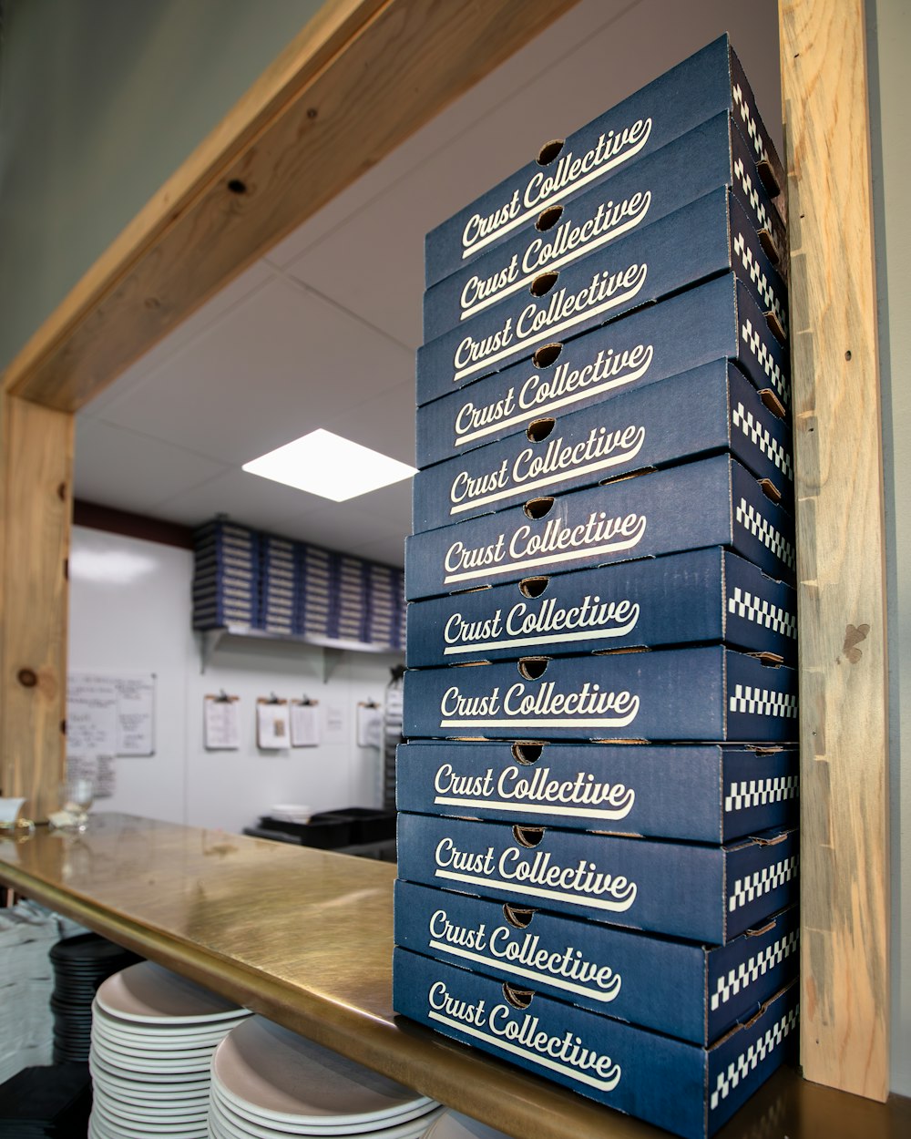 a stack of blue boxes sitting on top of a counter