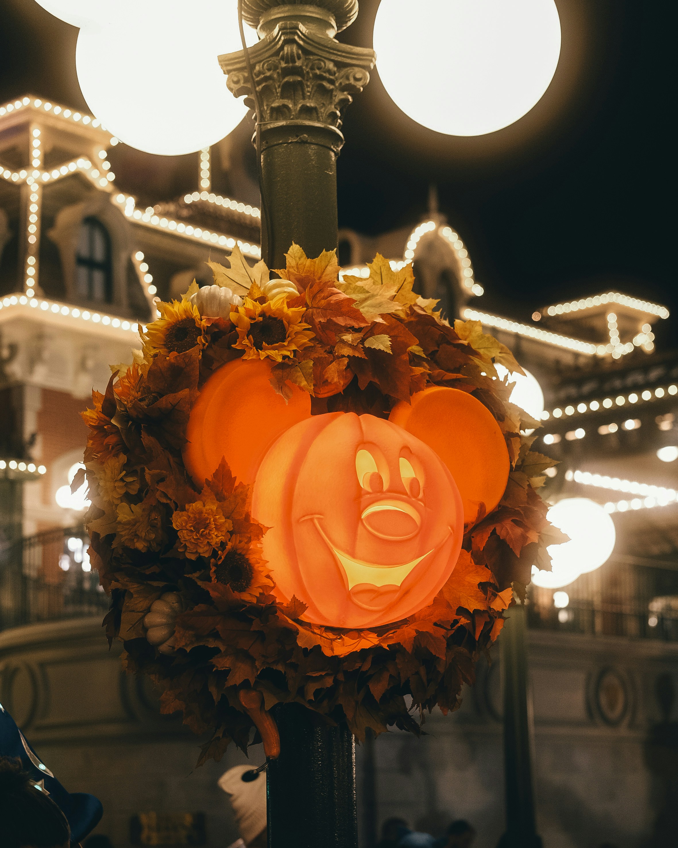 a lighted pumpkin with a face on it
