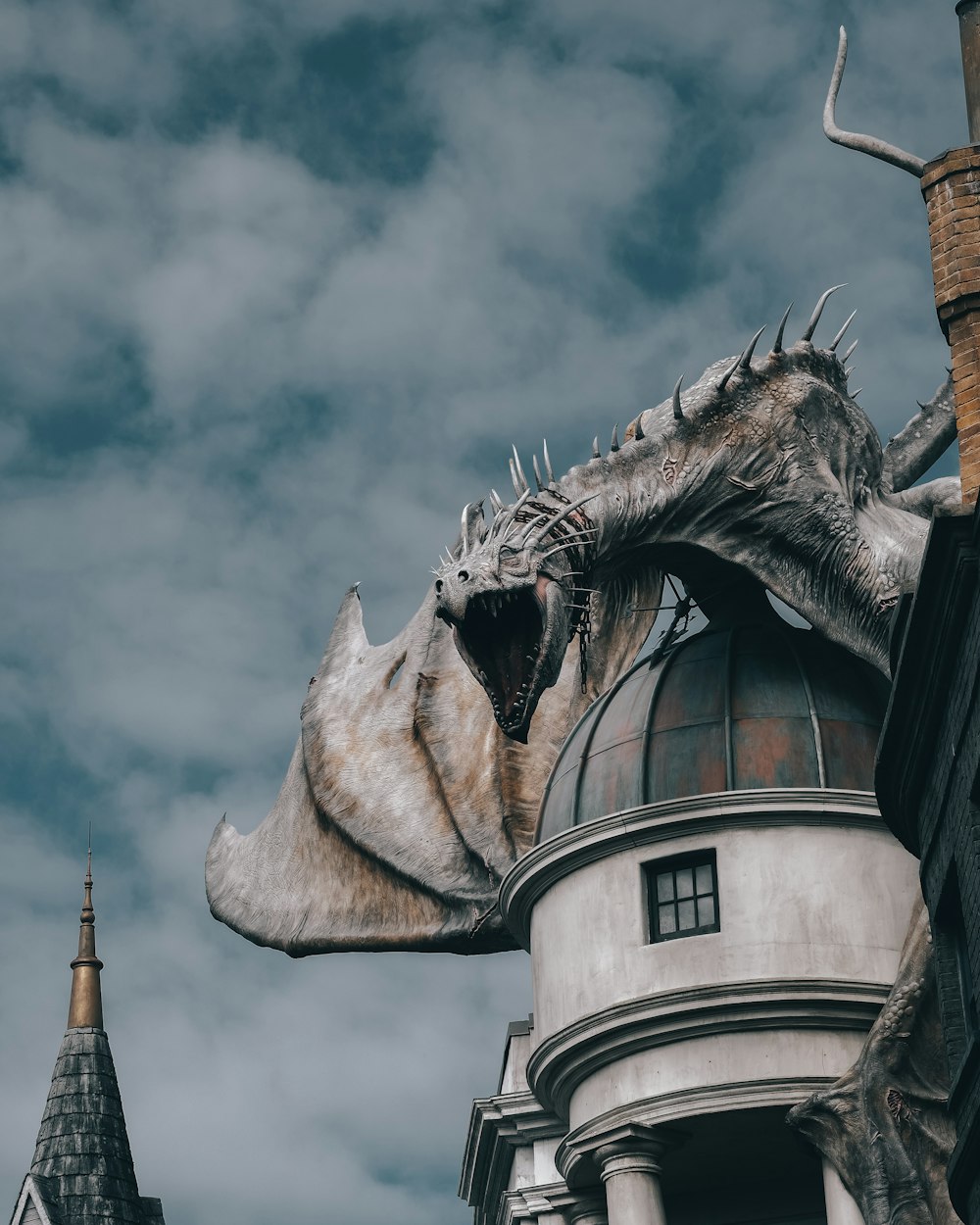 a dragon statue on top of a building