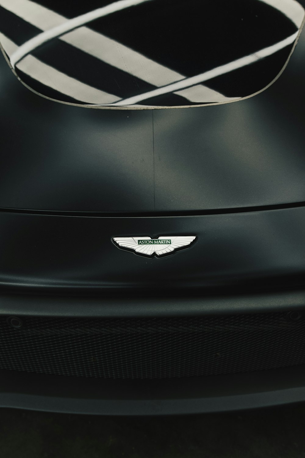 a close up of the front of a black sports car