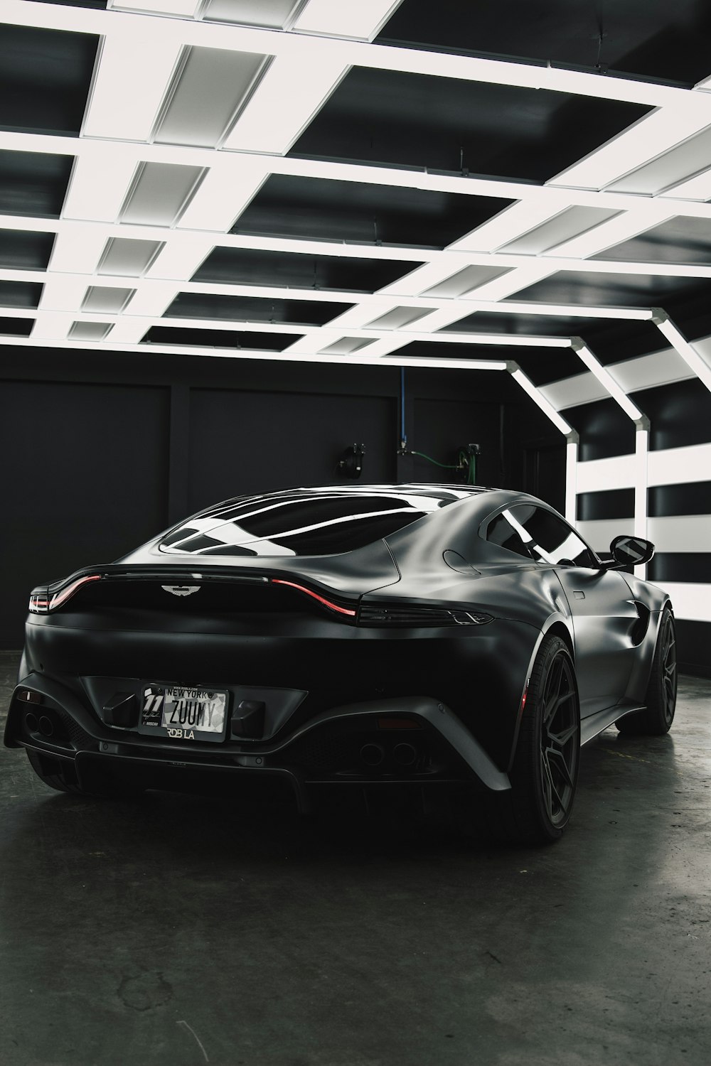 a black sports car parked in a garage