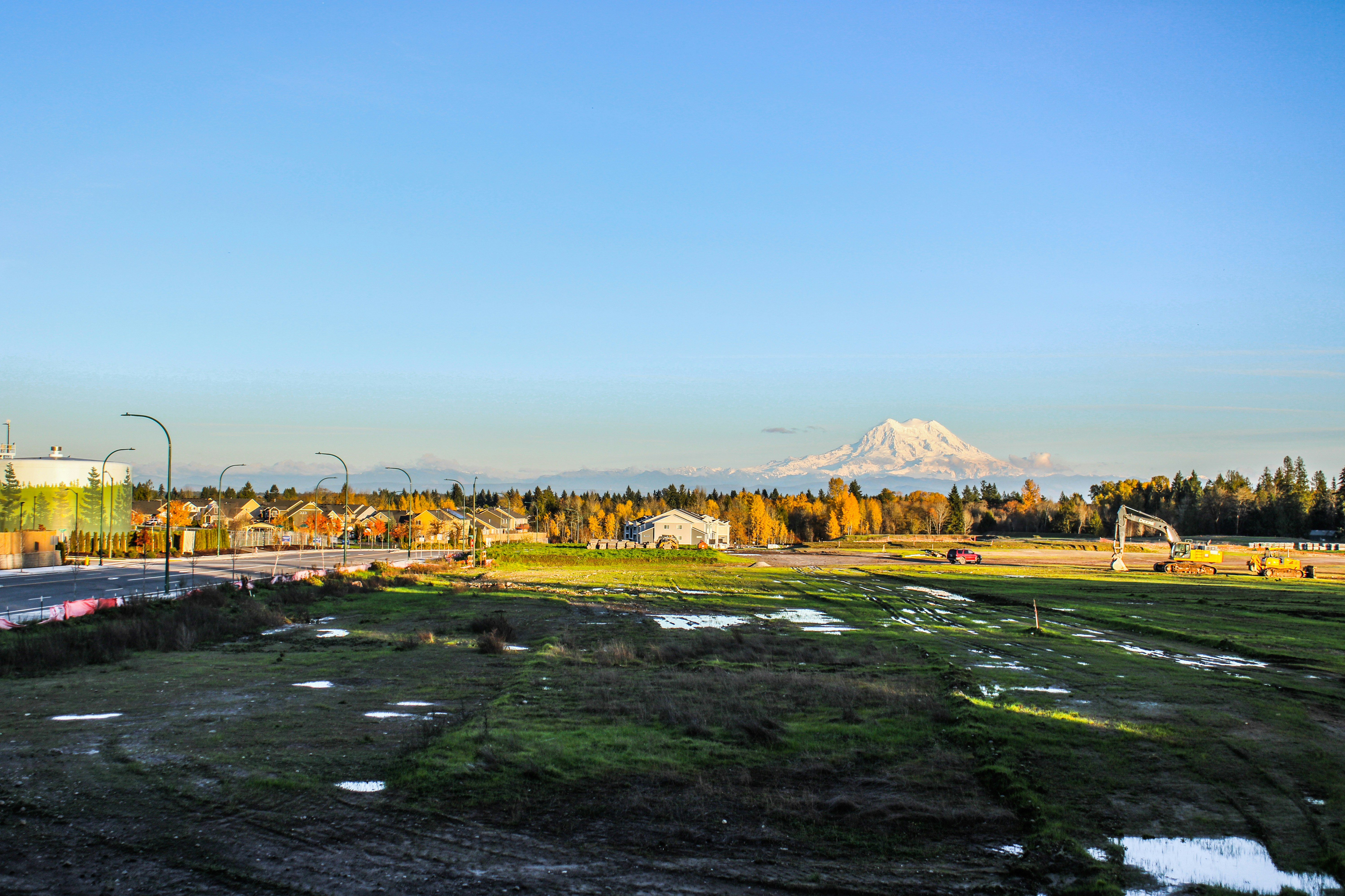 a view of a city with a mountain in the background, 