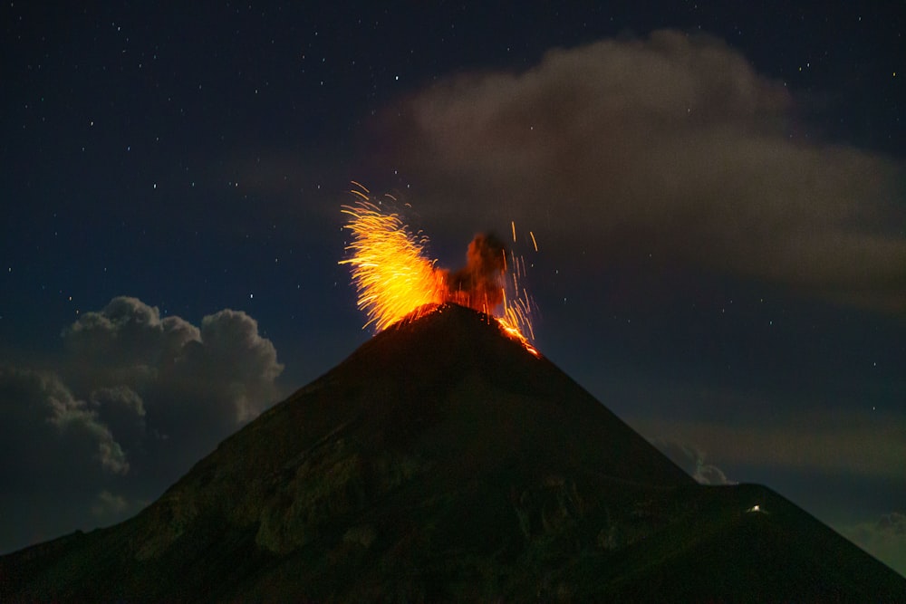 a volcano with a lot of lava spewing out of it