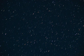 A vast, deep star trail swirling against a dark sky, hinting at cosmic patterns and futuristic fortune-telling.