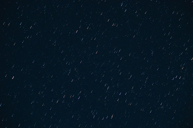 A vast, deep star trail swirling against a dark sky, hinting at cosmic patterns and futuristic fortune-telling.