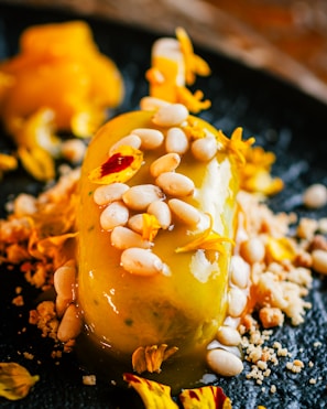 Bright yellow slime with a glossy finish, decorated with small flower charms.