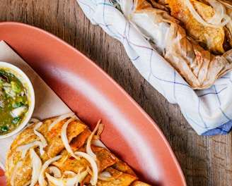 a plate of food on a wooden table