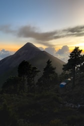 A serene sunrise over the misty mountain peaks viewed from the camp.