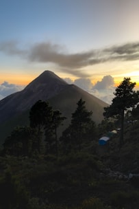 A serene sunrise over the misty mountain peaks viewed from the camp.