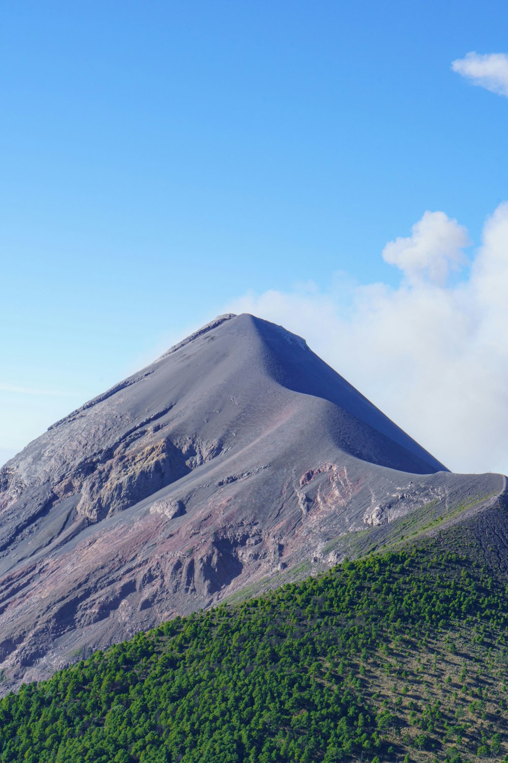 a very tall mountain with a sky background