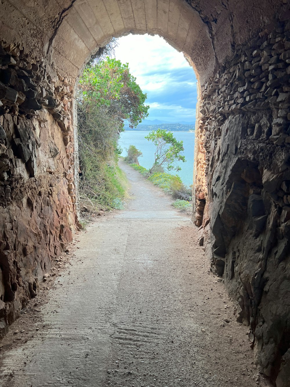 a stone tunnel leading into the ocean