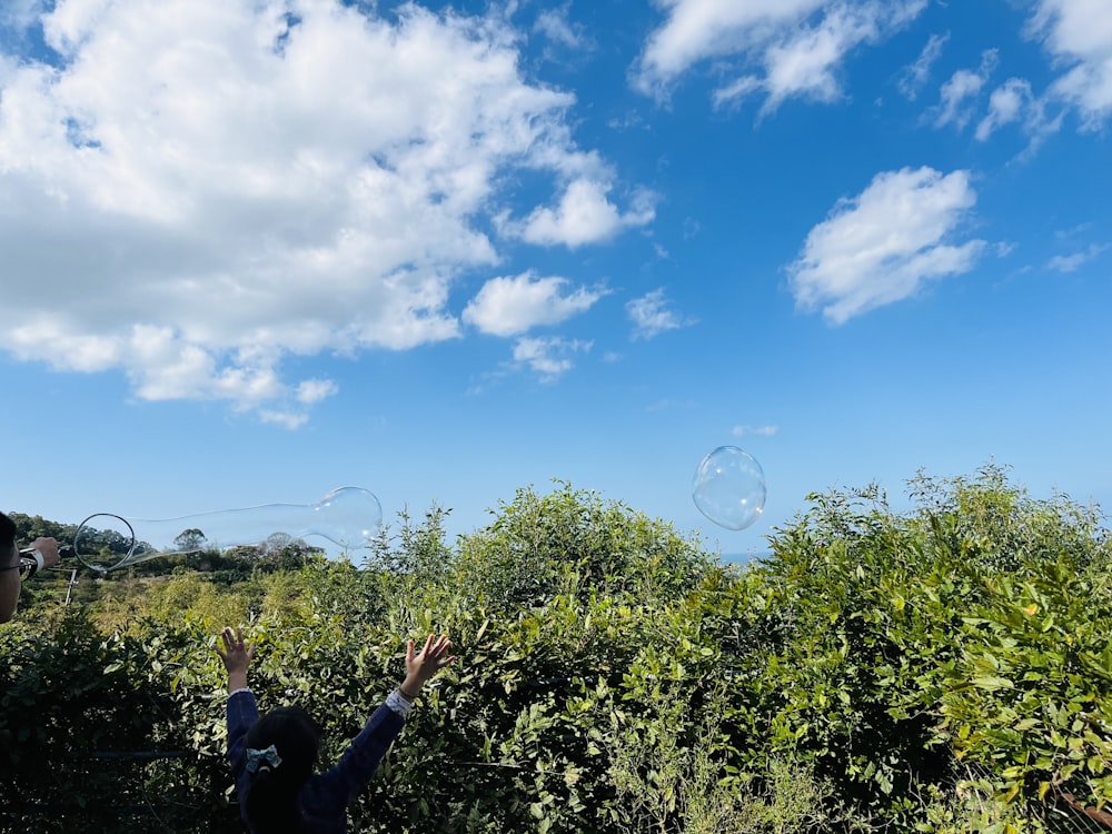 a man is flying a kite in a field