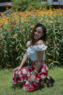 A durable garden kneeler with soft padding set up beside a flower bed in morning light
