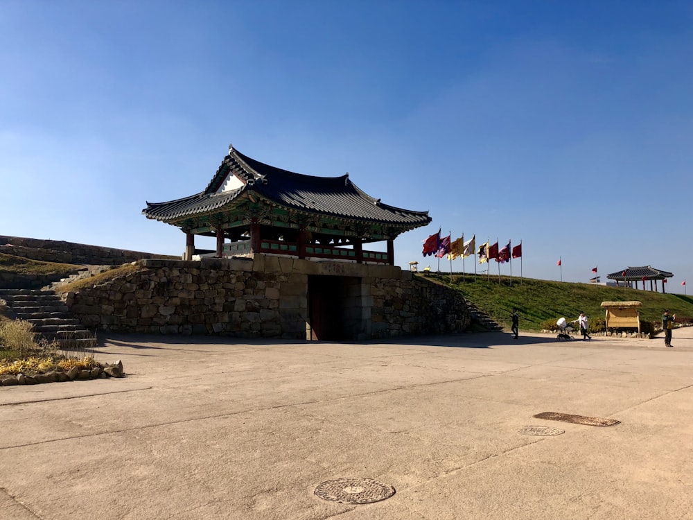 a building with flags flying in the background