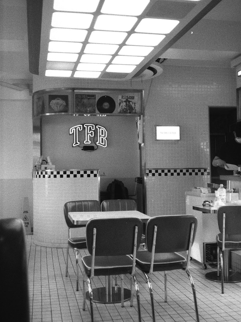 a black and white photo of a diner