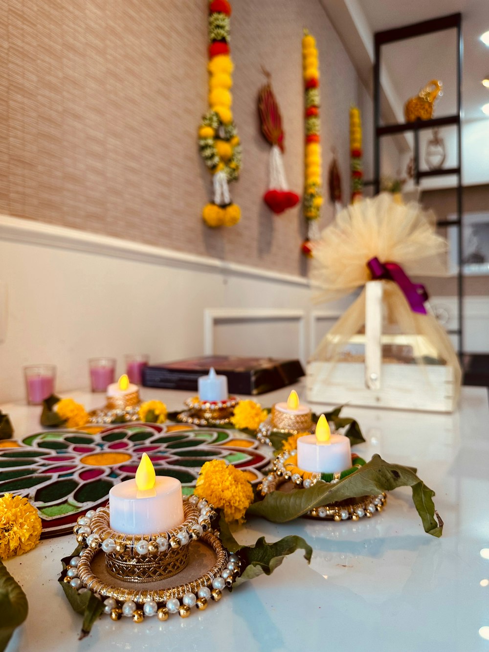 a table topped with candles and flowers on top of it