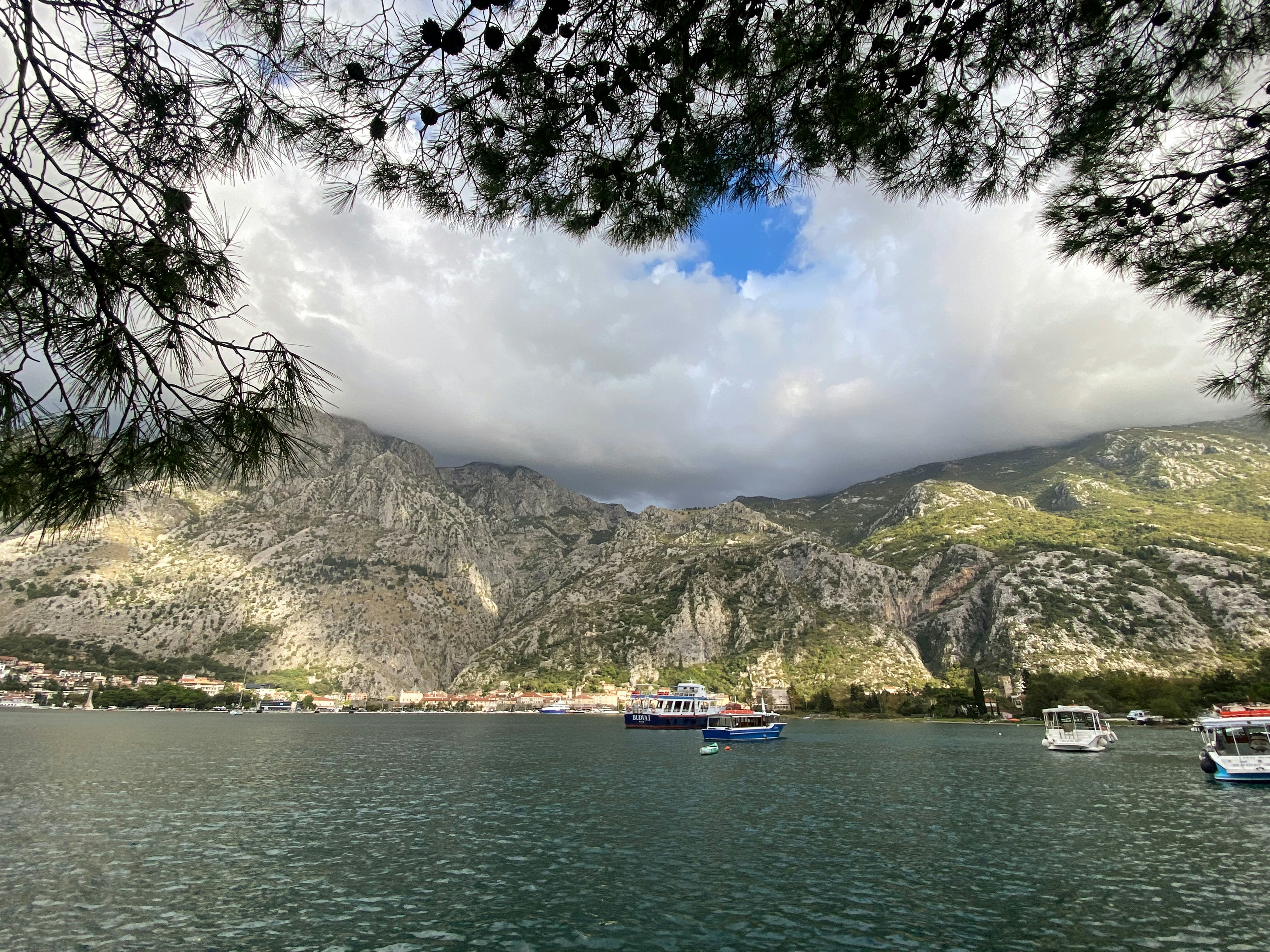 several boats floating on a large body of water, The Bay of Kotor