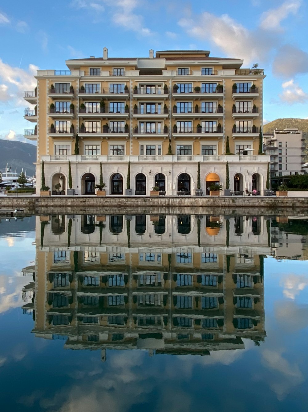 a large building sitting next to a body of water