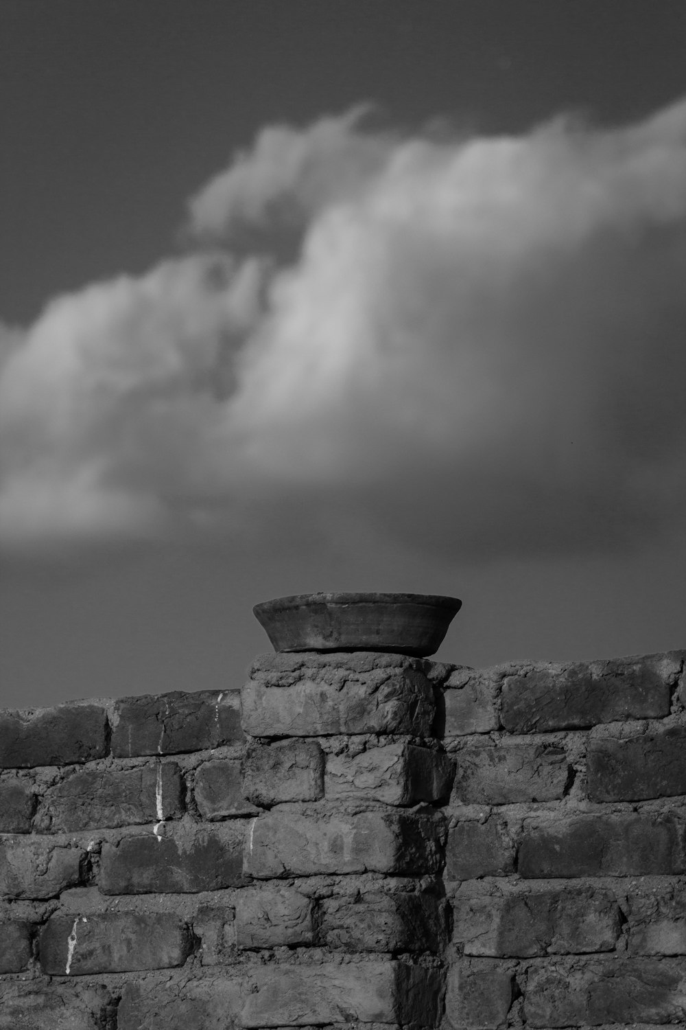 a black and white photo of a brick wall