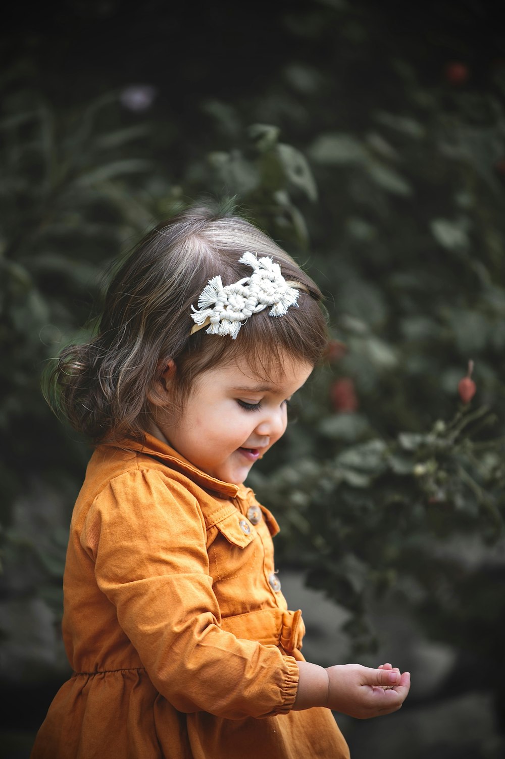 a little girl with a flower in her hair