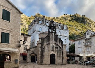 a stone building with a clock tower on top of it