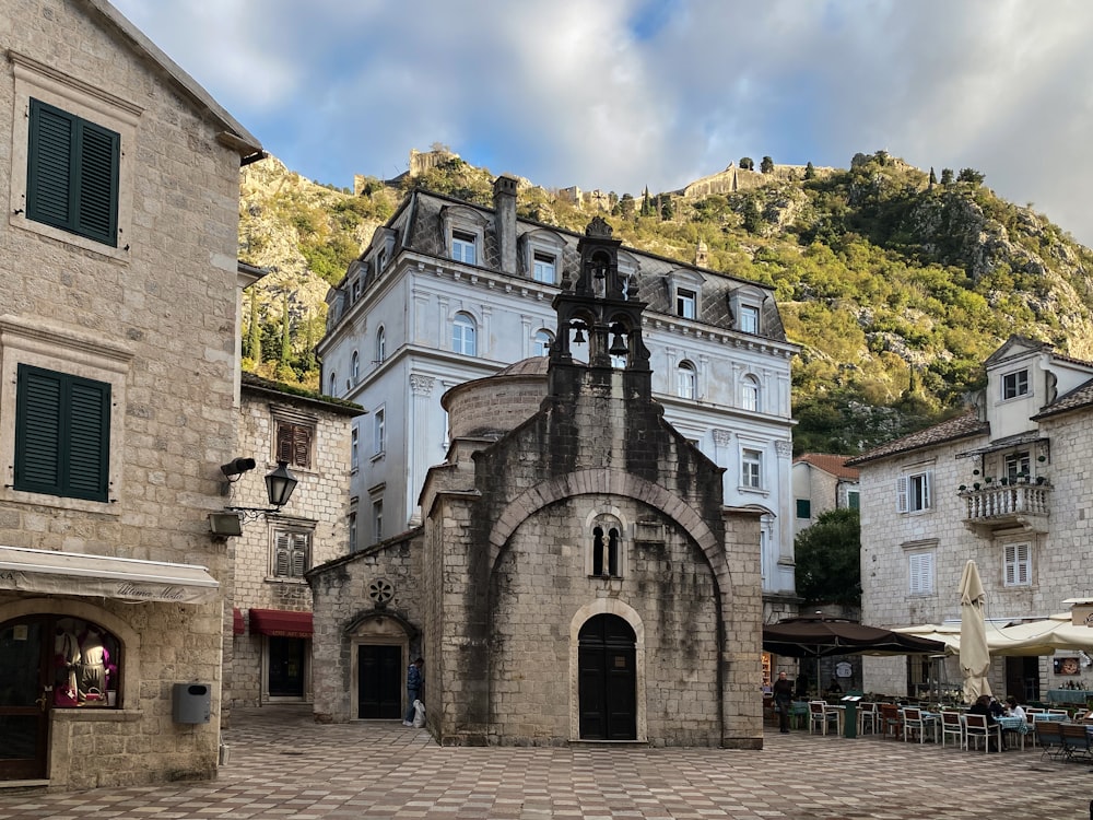 a stone building with a clock tower on top of it