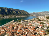Aerial shot of a charming coastal town in Spain with whitewashed buildings.