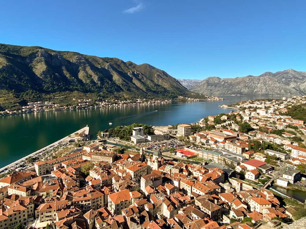 an aerial view of a city and a lake