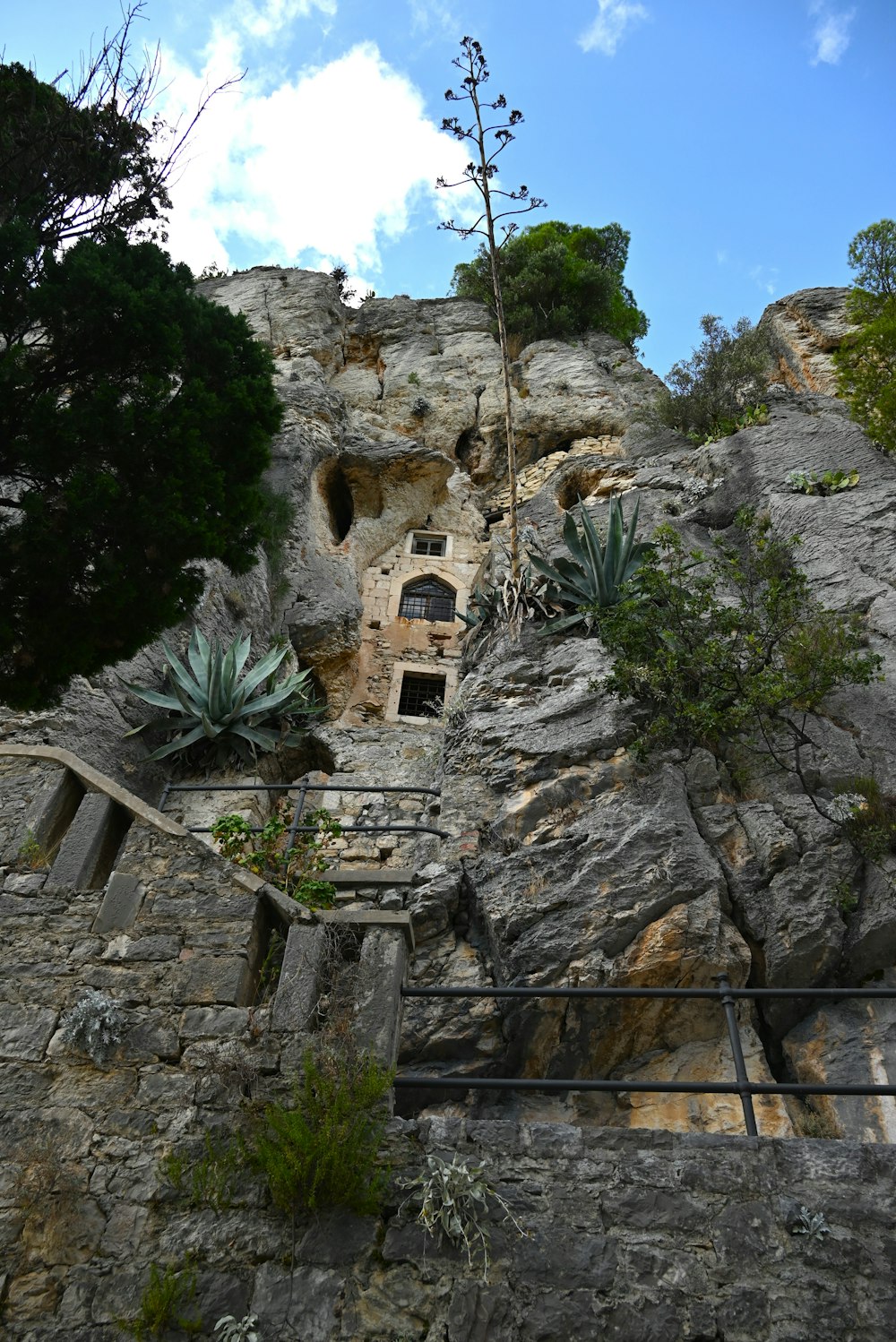 a stone house built into the side of a mountain