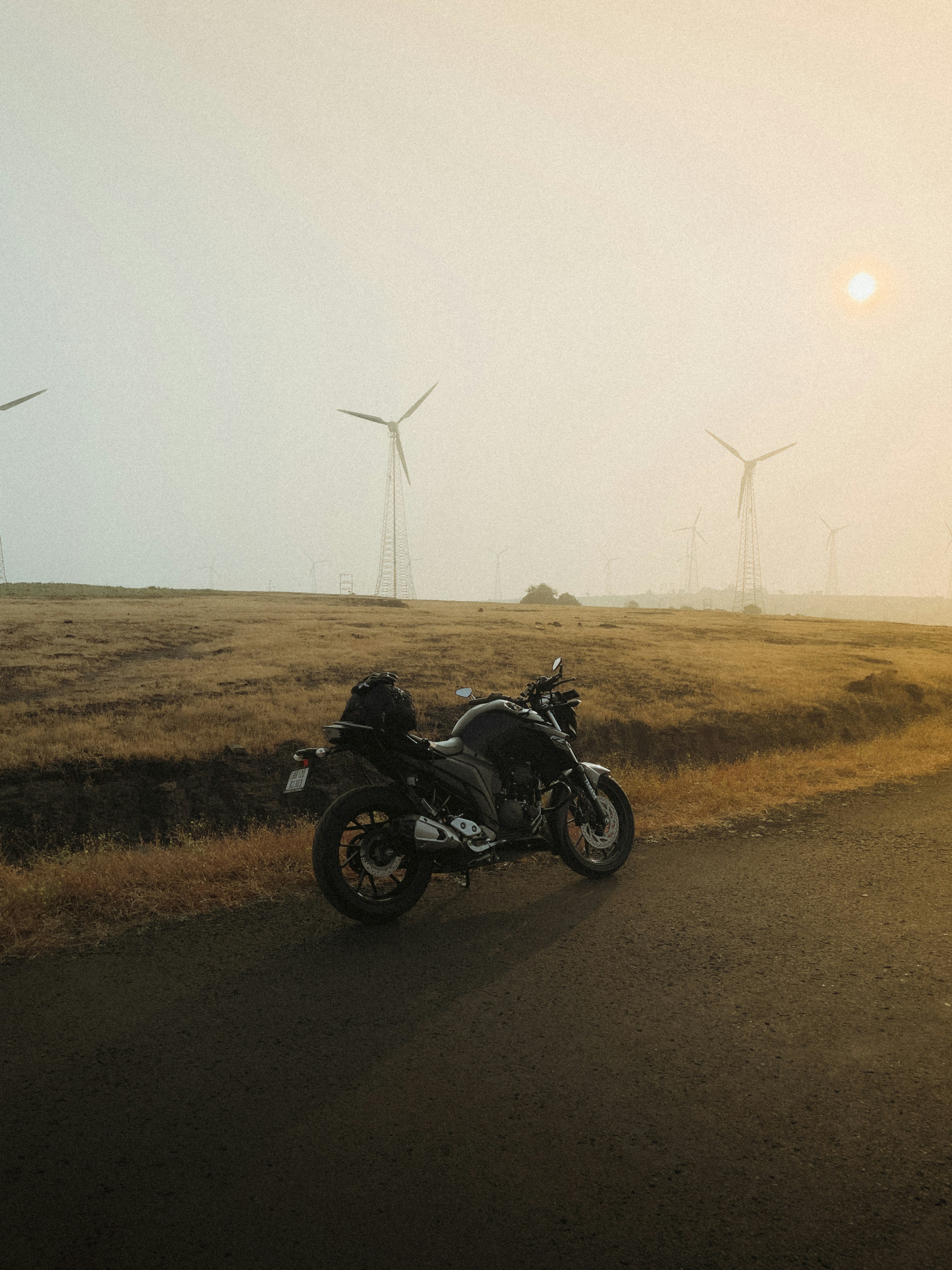 a motorcycle parked on the side of a road