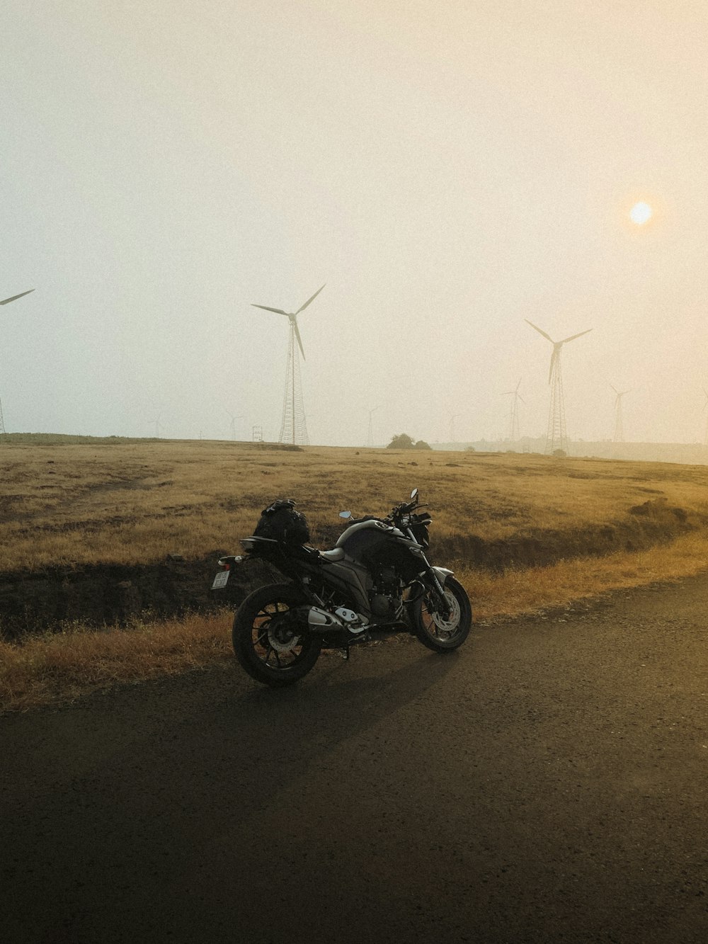 a motorcycle parked on the side of a road